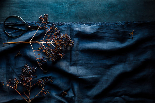 Decorative berries on a blue linen tablecloth