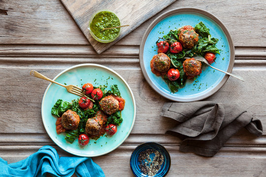 Meatballs with roasted tomatoes and spinach