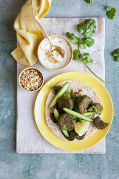 Spinach falafel wrap with cucumber and lettace