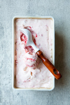 Roasted strawberry swirl ice cream with scoop