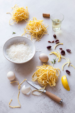 Preparing a pasta dish with homemade fettuccini pasta