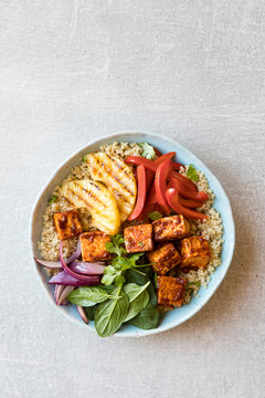 BBQ tofu quinoa bowl with grilled pineapple
