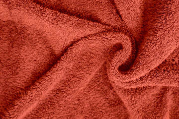 Fototapeta na wymiar Terry towel texture, fashionable shade. The fabric is twisted and laid in waves. Abstract background.