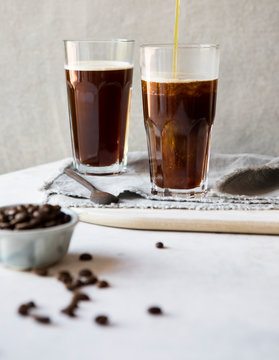 Pouring ghee into bulletproof coffee