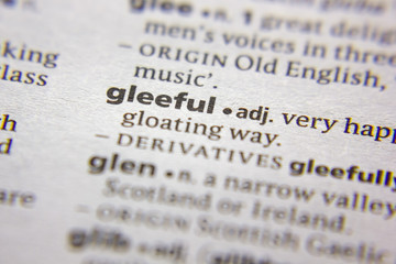 Word or phrase Gleeful in a dictionary.