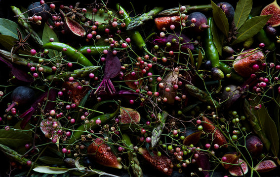 Arrangement of fresh culinary spices, vegetables and fruit