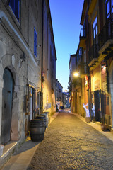 Fototapeta na wymiar Caiazzo, Italy, 11/12/2019. A narrow street among the old houses of a medieval village