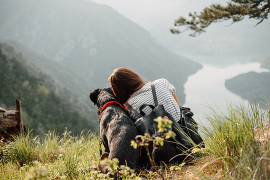 Woman And Dog In Nature