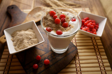 A glass of homemade yogurt with sprouted wheat. 