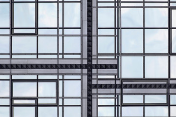 Realistic though unreal reworked photo of modern glass architecture. Windows of different shapes. Financial business building. Hi-tech composition with rectangular frames background and sky reflection