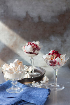 Desserts: crushed meringues with whipped cream, ruby red pomegranate molasses and pomegranate rubies