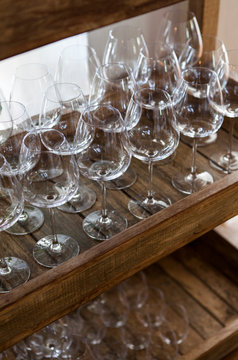 Empty wine glasses on a trolley in a cafe