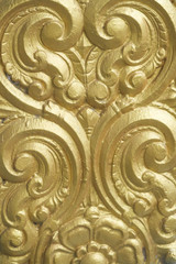 Fototapeta na wymiar Golden Color Swirly Curly Texture Pattern Design Or Temple Wall Decoration For Background