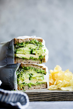 A healthy cheese and green salad sandwich on brown bread, with cucumber and cress.