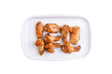 Fried chicken wings on white plate isolated on white background. Hot fastfood. Top view Food Image for menu card, web design, site, shop or delivery. High quality retouch and isolation