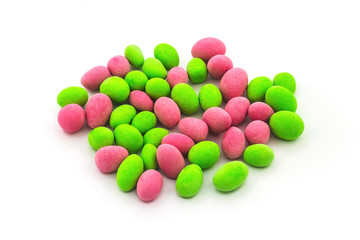 Round candy with peanuts in sweet shell on white isolated background_