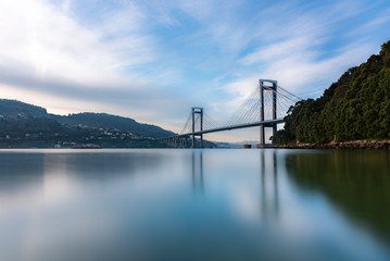 Long exposure, silk effect in Rande bridge on sunset landscape, Puente de Rande, Rande, Vigo, Pontevedra, Galicia, Spain