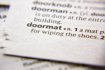 Word or phrase Doormat in a dictionary.