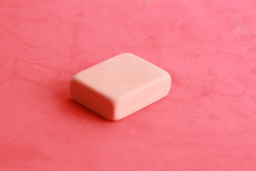 pink eraser on colorful background