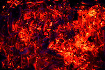  abstraction yellow-red coals smolder against the background of the night, the remains of firewood