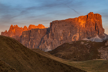 Landscape view of the Italian Dolomites on Passo Giau. Sunset with beautiful blue sky and setting sun.