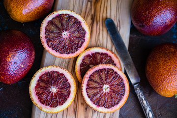 red oranges wooden board cut