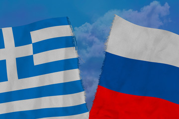 two colored flags on torn fabric, a symbol of international relations between Russia and Greece, the concept of global business, the deterioration of political and economic relations