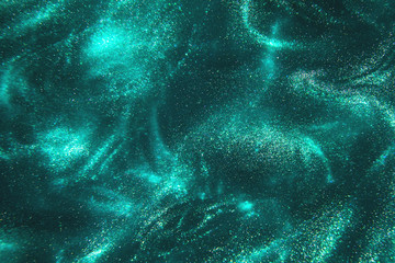 Abstract elegant, detailed mint glitter particles flow with shallow depth of field underwater. Holiday magic shimmering luxury background. Festive sparkles and lights. de-focused.