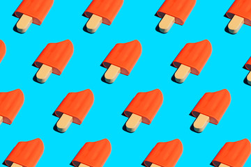 Colorful ice cream popsicle pattern on bright blue background.