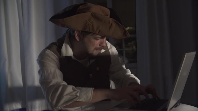 a computer pirate sitting at the laptop funny concept of digital security