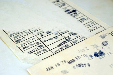 Torn Vintage Library Book Due Date Pocket with Many Date Stamps