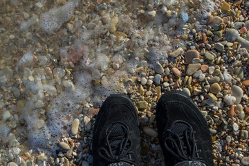 pebble shoes near the sea