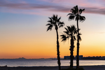 Fototapeta na wymiar Sunset on the empty mediterranean beach. No people on spanish coast during coronavirus quarantine