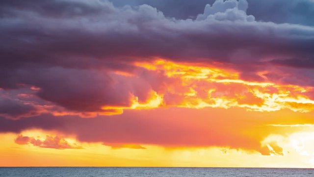 Time lapse of dramatic clouds during sunset over Baltic sea