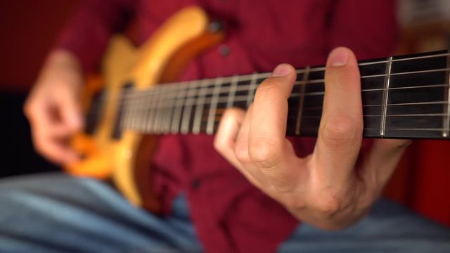 Close up of man playing a musical instrument