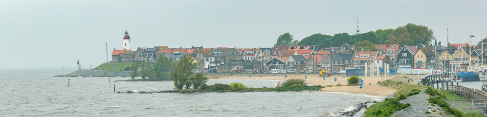 Fototapeta Panorama of the port town of Urk, view from the breakwater, lighthouse. obraz