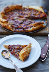 Delicious almond plum cake on puff pastry.