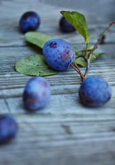 delicious fresh plums on a wooden table
