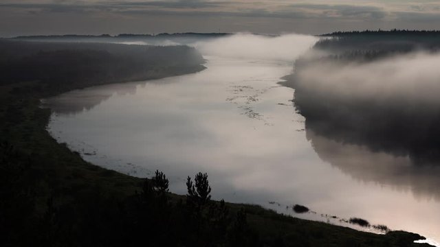 Time lapse of fog over Daugava river bend in full moon night, Nature Park "Daugavas Loki"