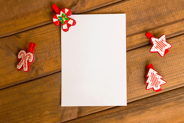 New Year card, white sheet on a wooden background, New Year and Christmas greetings
