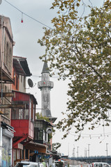 Obraz premium Bottom view of old beautiful brick building in european city. Photography with unusual house facade in the summertime, architecture concept.