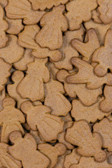 Fototapeta premium Gingerbread figures for background. Christmas decor. Man and woman with smiling faces. Vertical