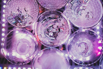 Beautiful tower line of different colored alcohol cocktails wit on a party event, tequila, martini, vodka, and others on decorated catering banquet table
