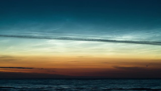 Time lapse of noctilucent clouds over sea