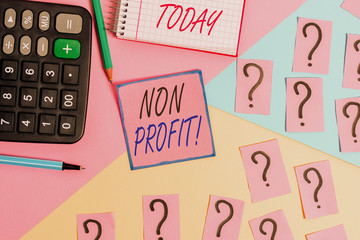 Word writing text Non Profit. Business photo showcasing not making or conducted primarily to make profit organization Mathematics stuff and writing equipment above pastel colours background