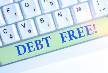 Writing note showing Debt Free. Business concept for does not owning any money or things to any individual or companies