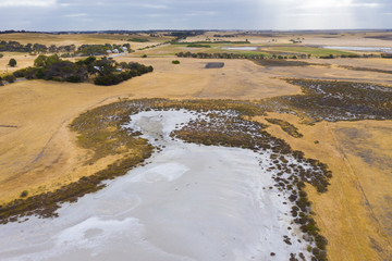 A large fresh water dam on Hindmarsh Island south of Adelaide in Australia that is dry due to drought and full of salt