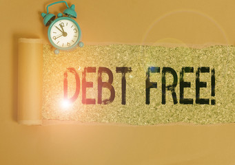 Conceptual hand writing showing Debt Free. Concept meaning does not owning any money or things to...