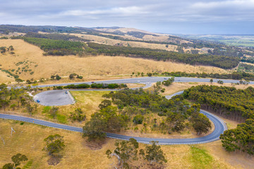 A carpark and road system running through large green farmland south of Adelaide in Australia