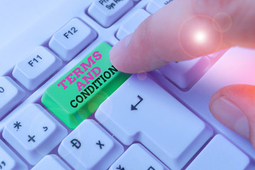 Writing note showing Terms And Conditions. Business concept for rules that apply to fulfilling a...